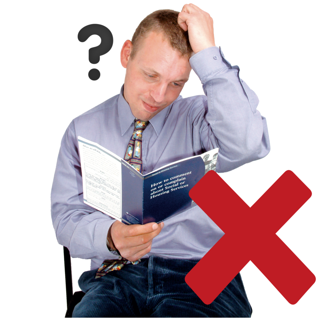 A man holding a book with a red cross near him