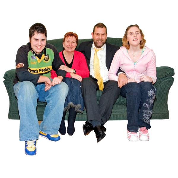 A family of 4 sitting on a couch