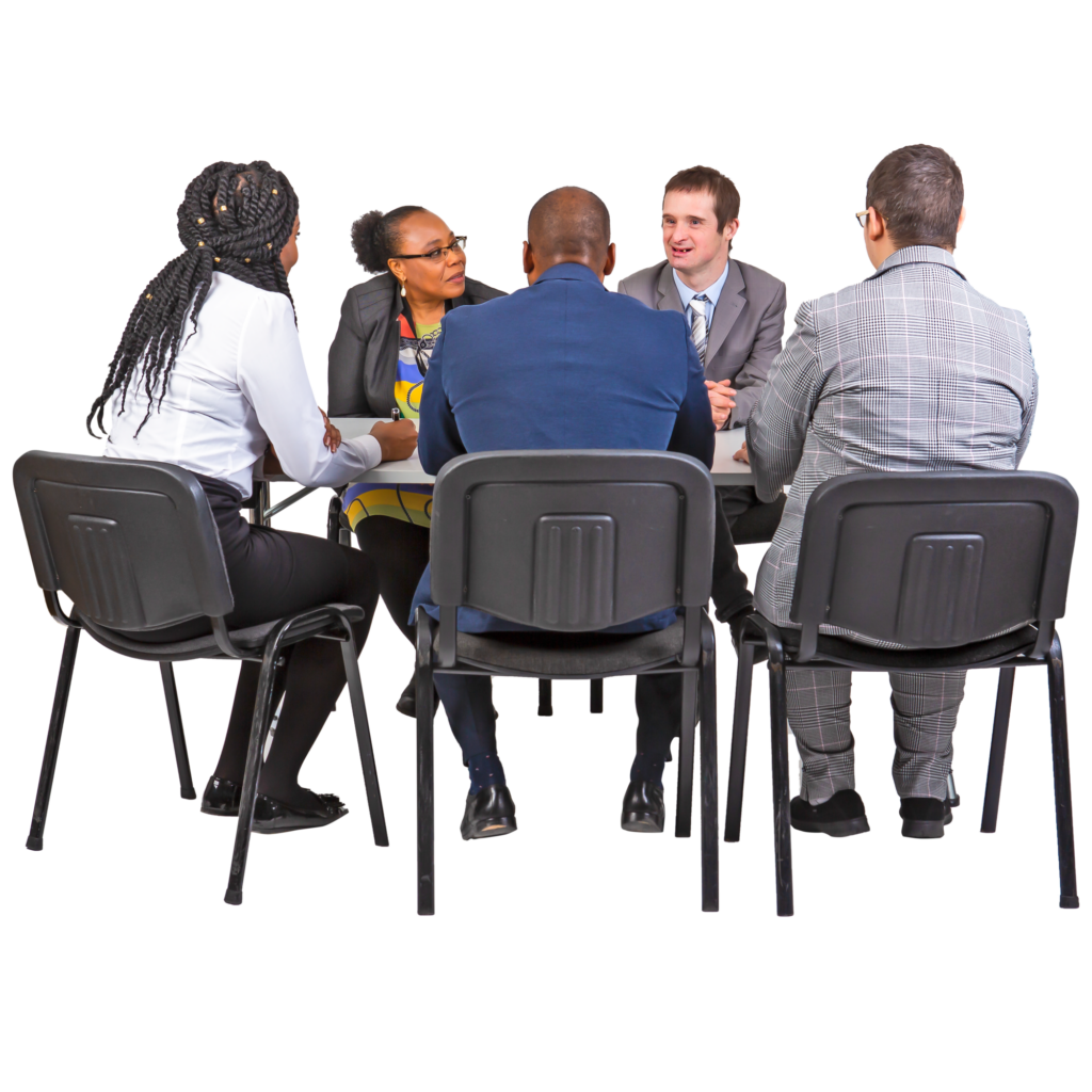 A group of people sitting in a meeting