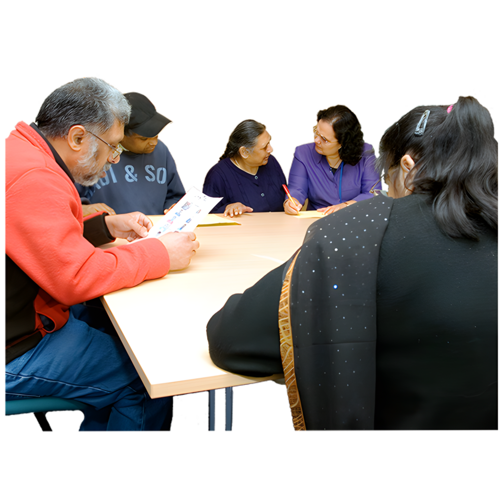 A group of people meeting around a table.