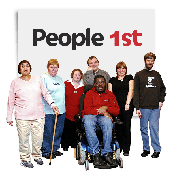 A group of 7 people with the words People first above them