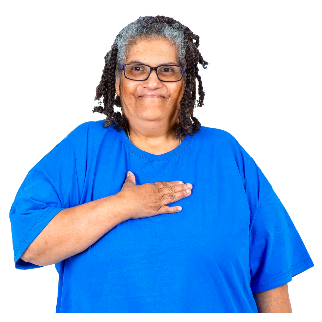 A proud woman with her hand on her chest.