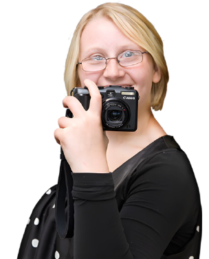 A girl holding a camera.