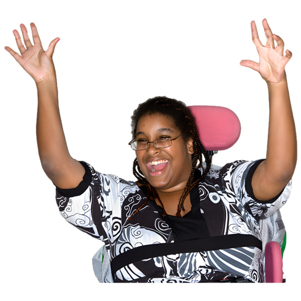 A woman raising both hands and smiling.